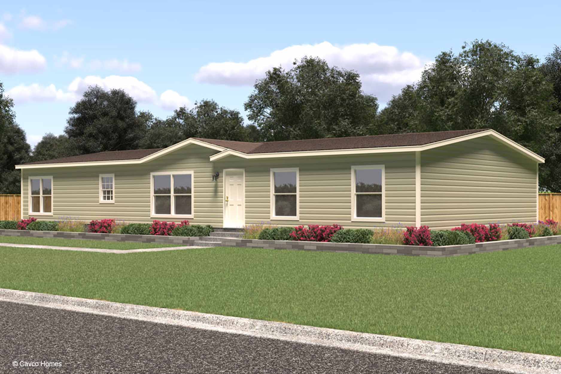Single-story beige manufactured home with white trim, surrounded by grass, shrubs, and a wooden fence. This manufactured home rendering highlights charming curb appeal in a peaceful setting.
